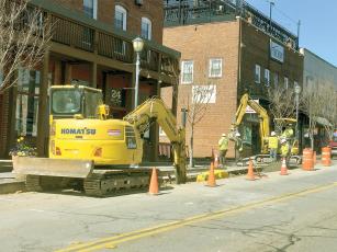 Crews install pipe on River Street to join what’s already been put down along Church Street.