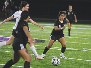 Gilmer High School’s Gimena Domingo-Tercero (9) made her penalty kick versus West Hall last Saturday to help the Cats earn their first region win. 