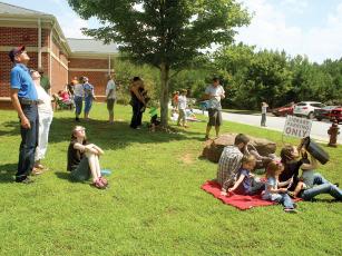 A crowd gathers outside the Gilmer County Library for the 2017 solar eclipse. 